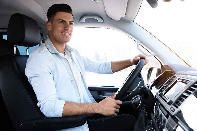 Young guy driving his car