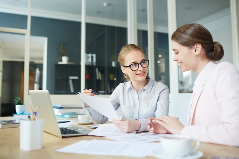 women talking in office