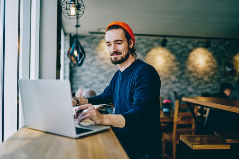 man checking laptop