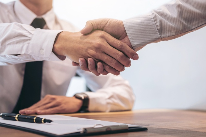 two men shaking hands