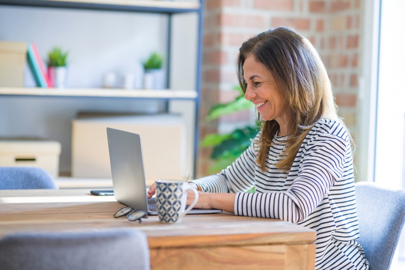 smiling woman on laptop