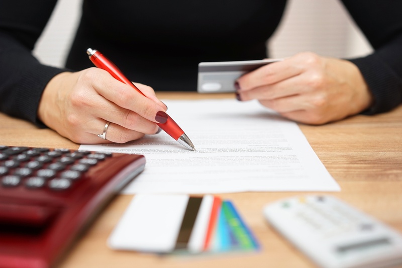 Woman looking at credit card bill