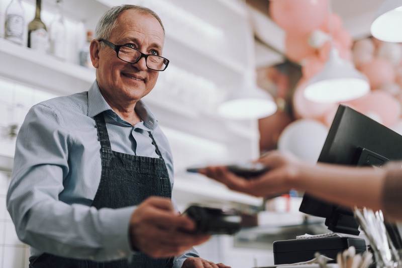 man paying by credit card