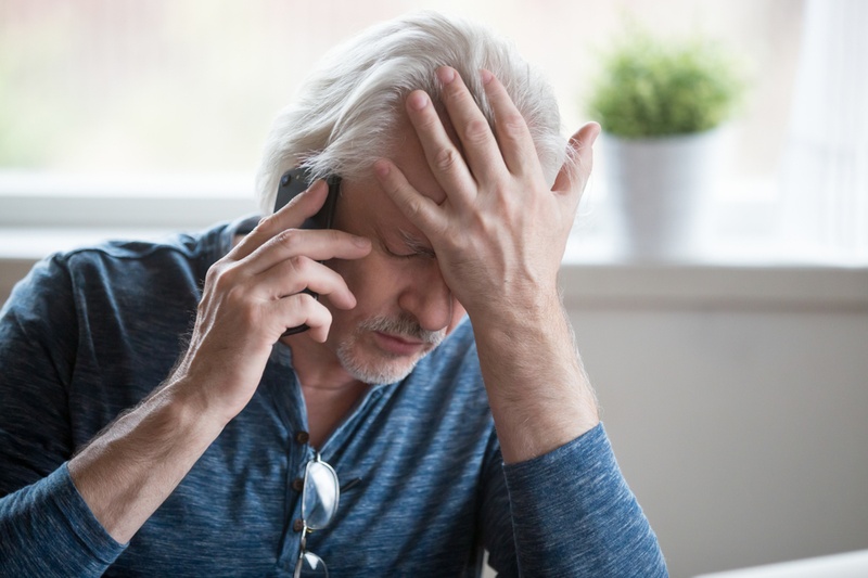 stressed man on phone