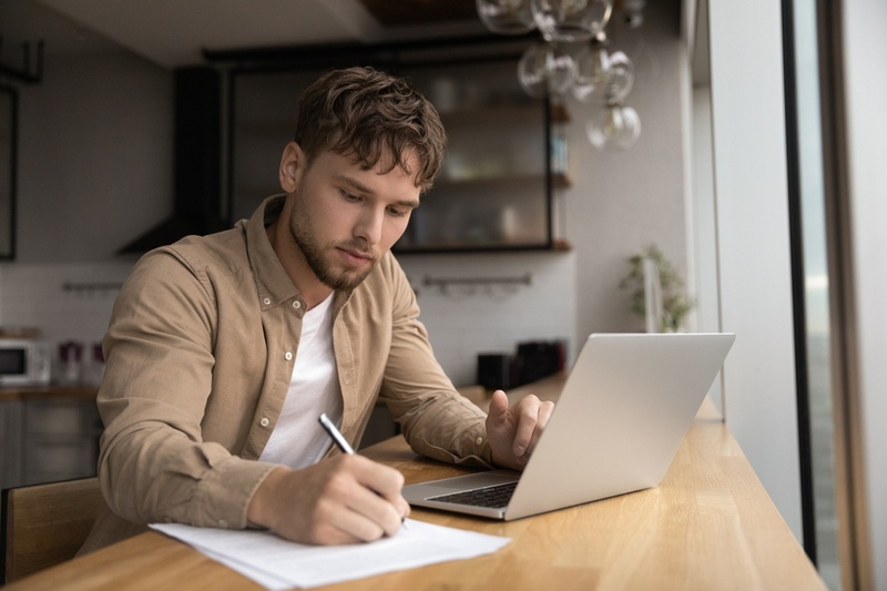 man making notes