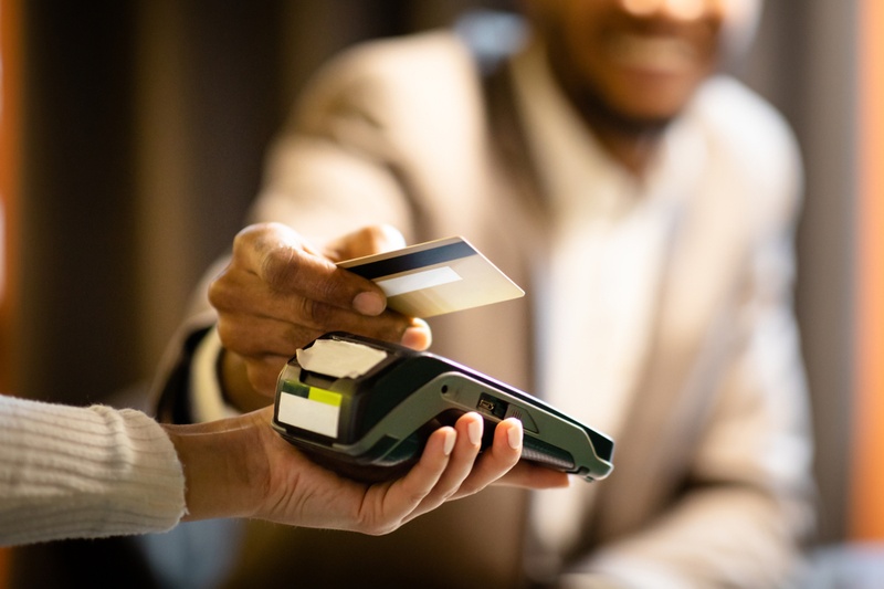 businessman paying by card