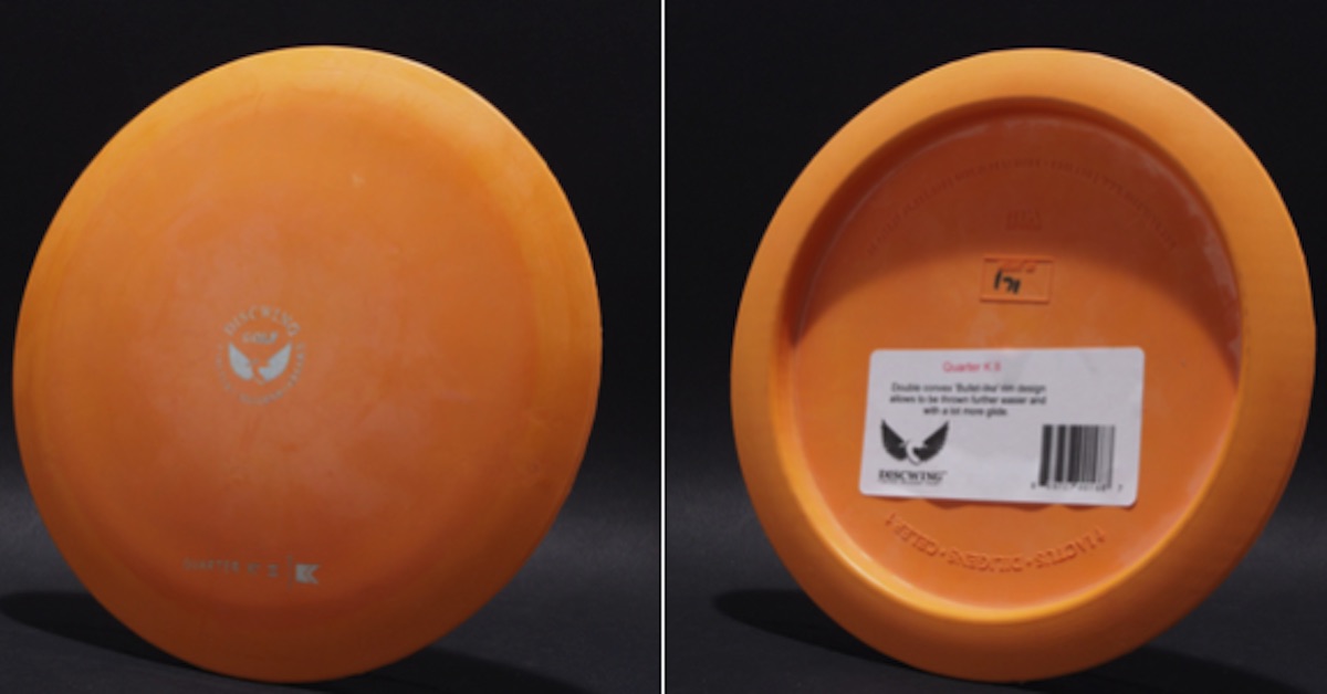 Orange disc golf distance driver's top and bottom