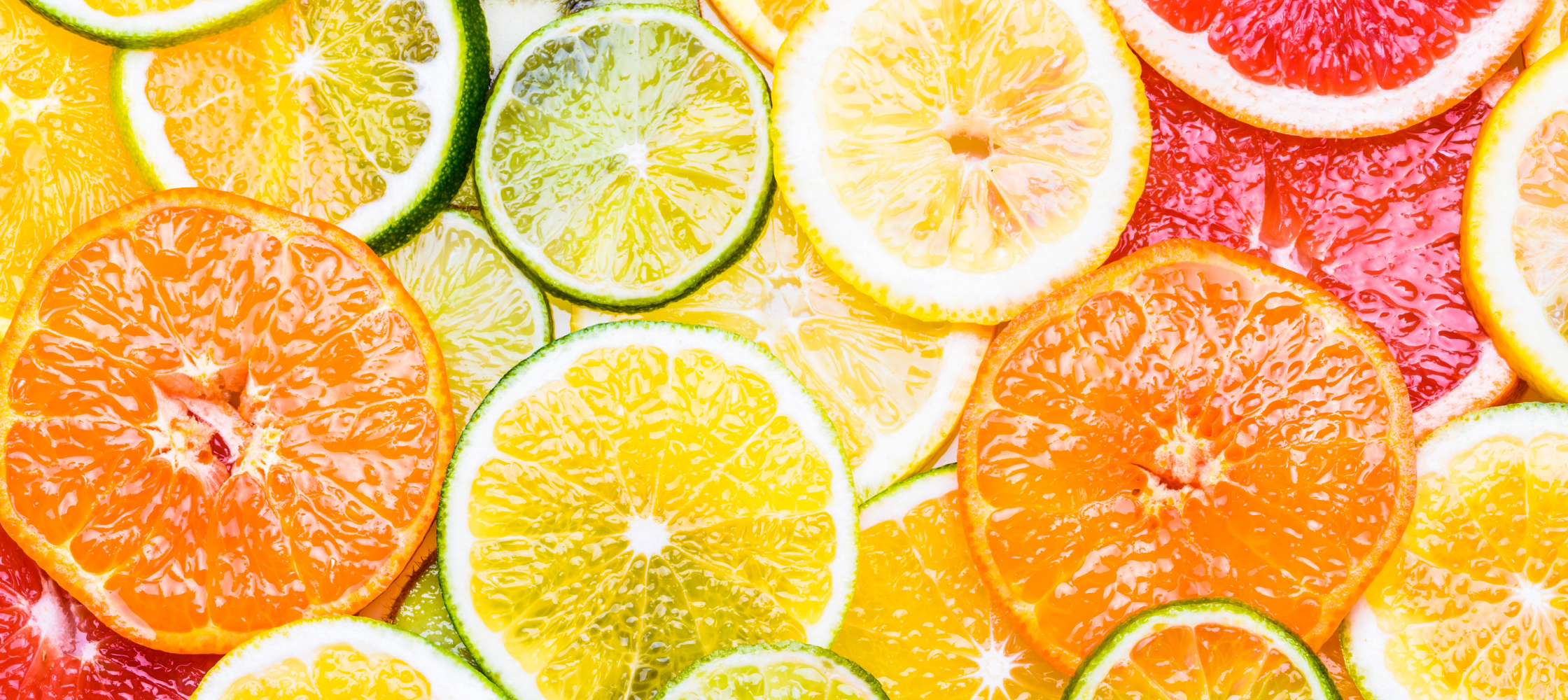 Image to represent Vitamin C absorbing in skin portrayed by a selection of citrus fruits