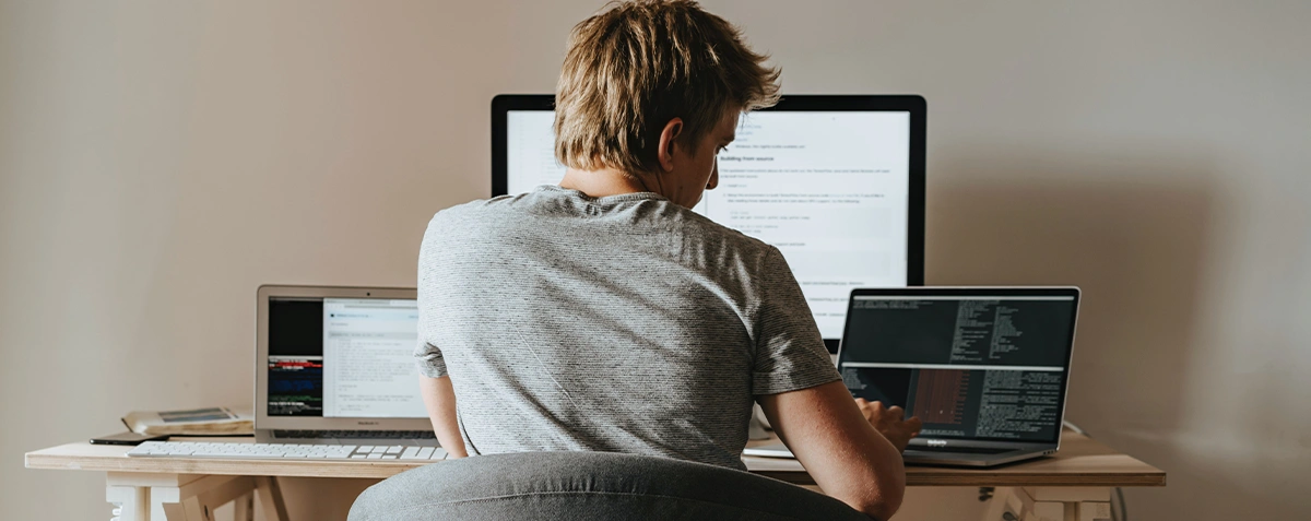 Person using several computer devices