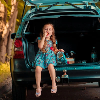 Little girl eating snacks.