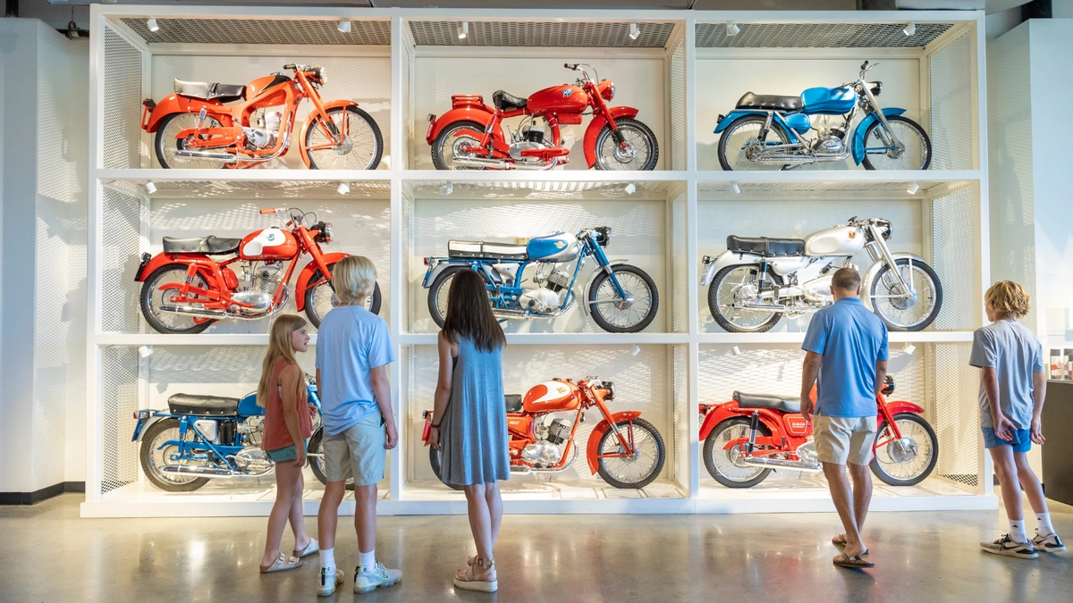 Wall of vintage bikes at the Barber Vintage Motorsports Museum in Leeds.