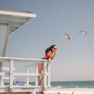 Woman looking at the ocean.