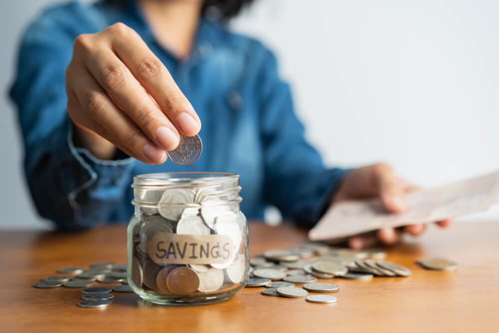 Woman putting money into savings through title loans.