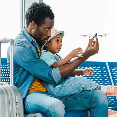 Dad and toddler in airport.