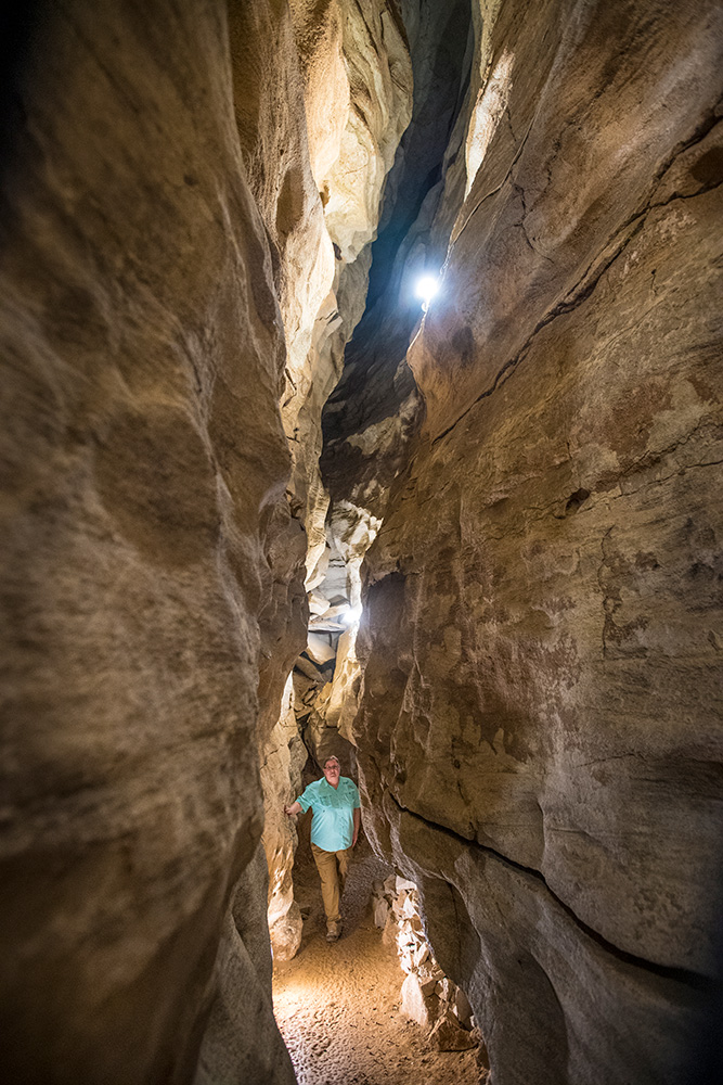 Person exploring Rickwood Caverns