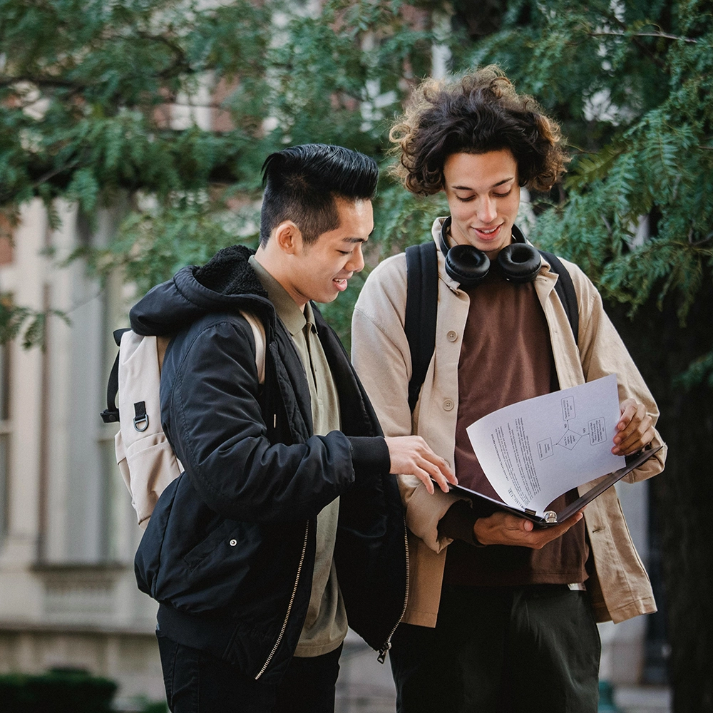 Classmates walking University grounds.webp