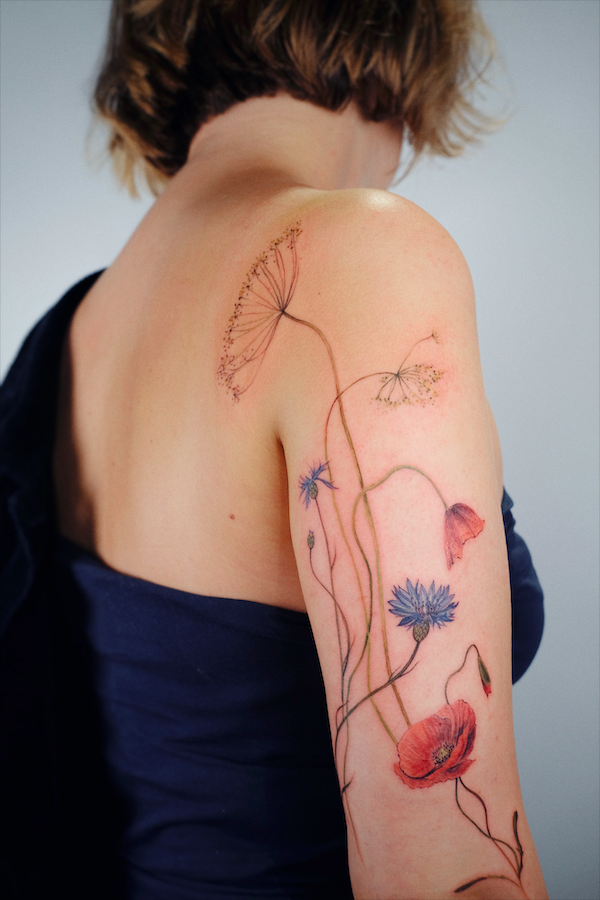 Elena Fedchenko tattoos of poppies and multiple flowers