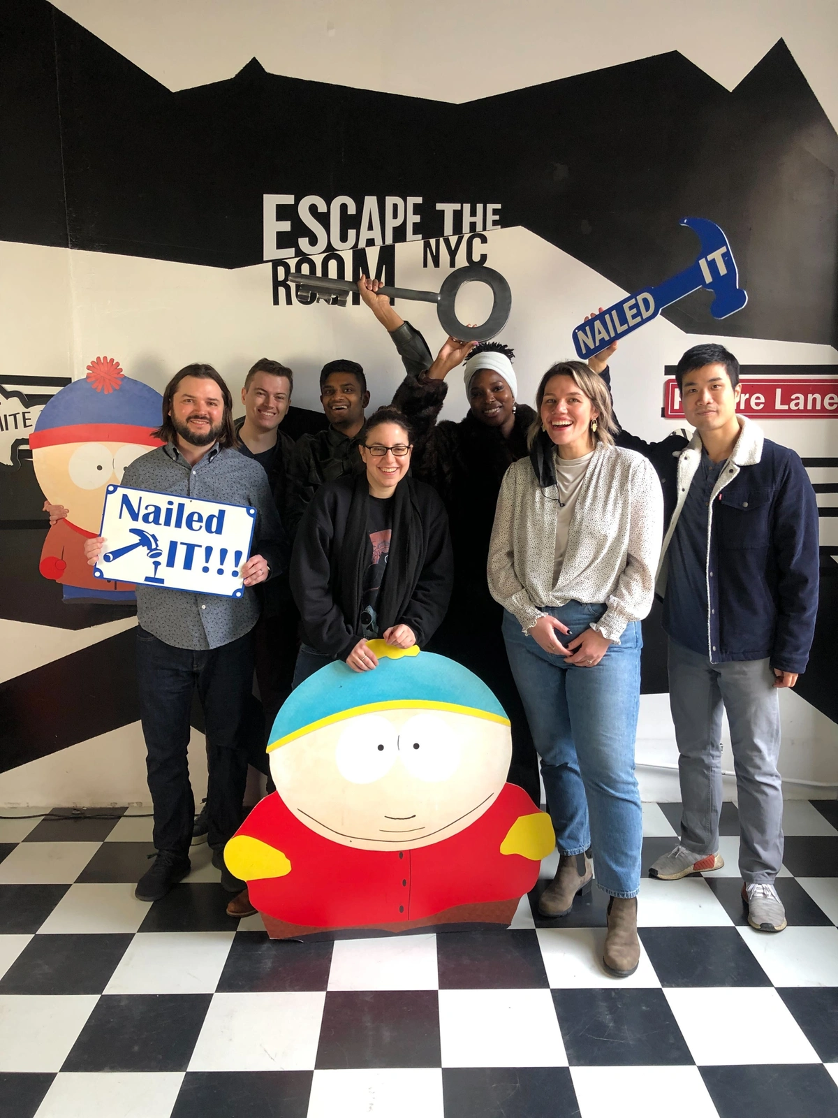 TeePublic employees posing at an escape room
