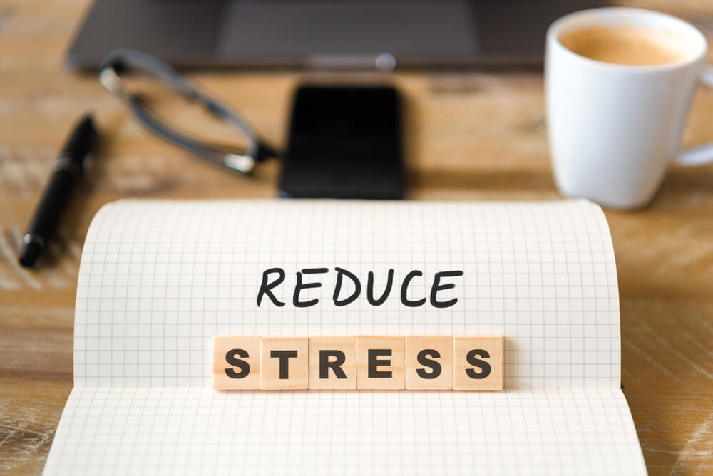 reduce stress written in a notepad