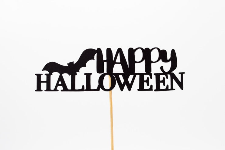 happy halloween social media post with a sign