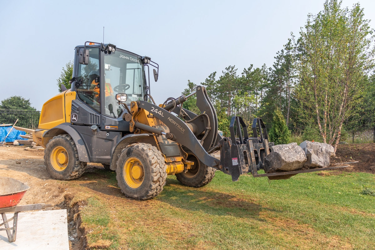 John Deere 244L Wheel Loader with fork attachments