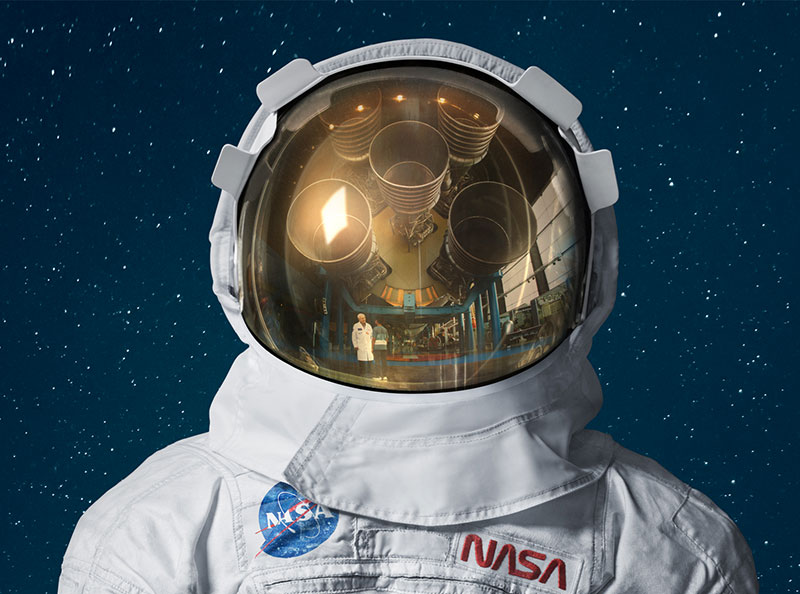 Astronaut in space suit staring at the camera with reflection