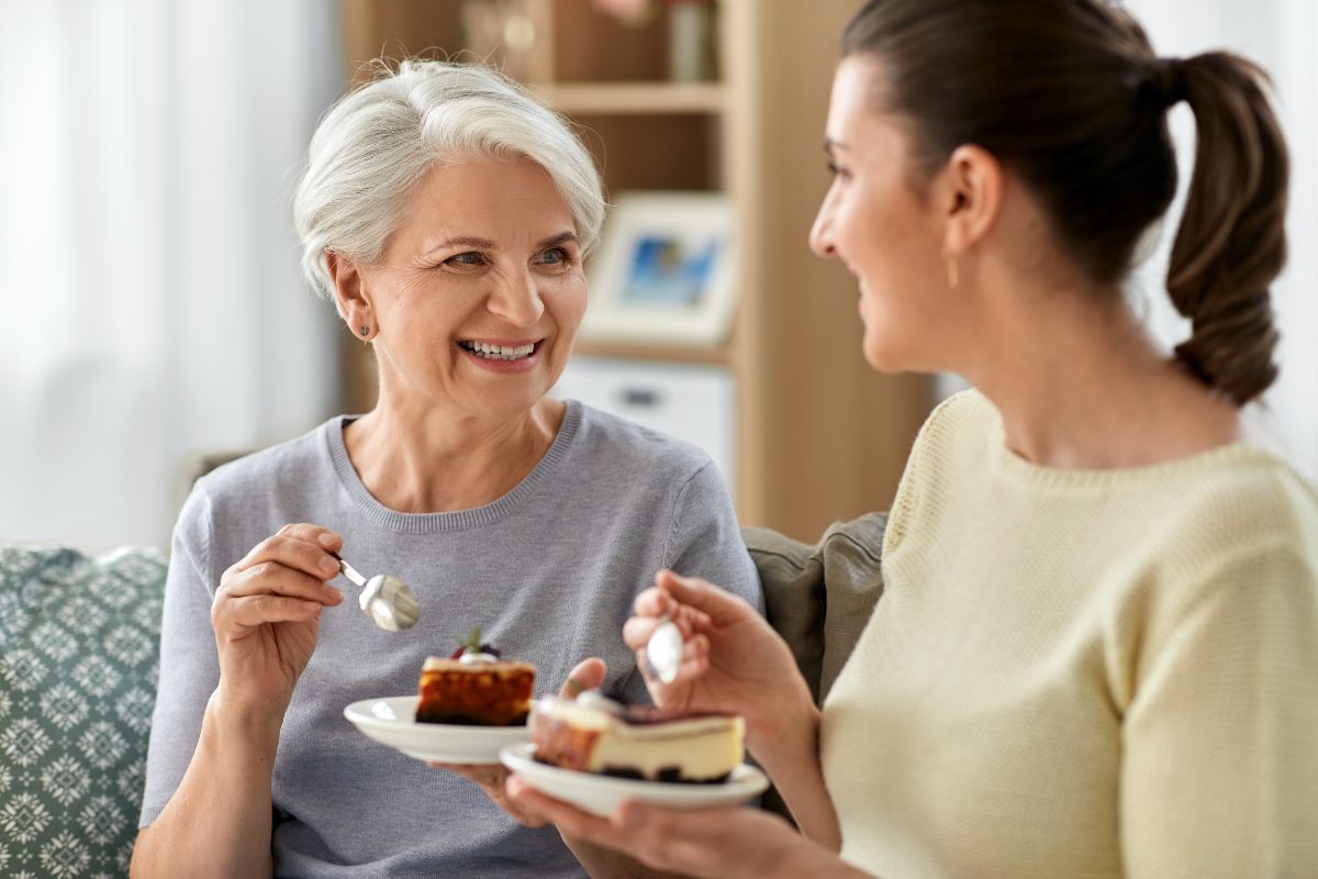 two women eating cake. you cant have medicare advantage and plan g