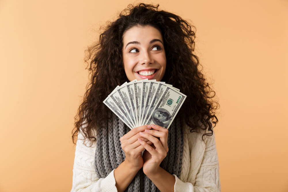 woman happy with payday loan cash
