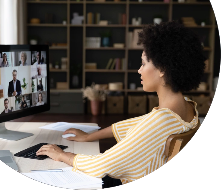 African American business woman holding video conference call conversation on computer with diverse colleagues