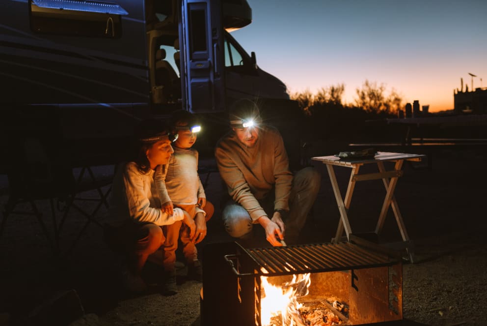 family grilling at sunset in arizona