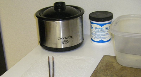 view of a jewelers pickle station including crock pot, sparex pickle, quench bowl, and copper tongs