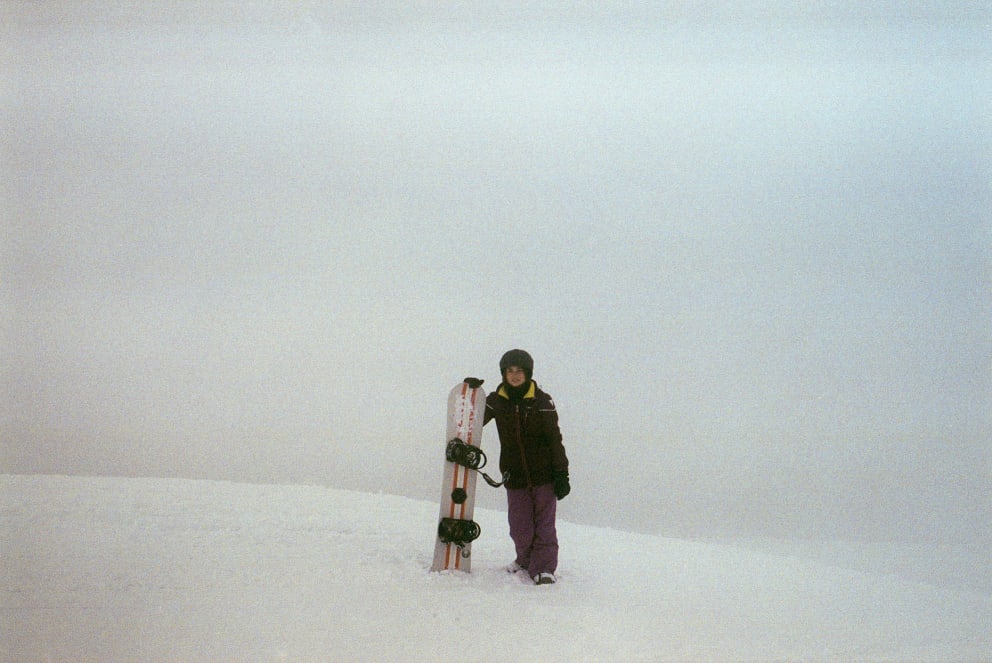 woman snowboaring film photo