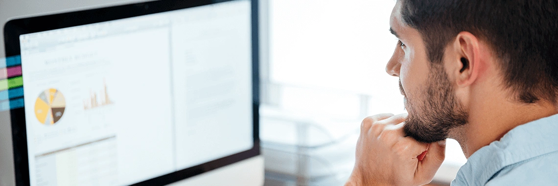 Man staring at his computer.