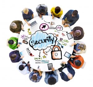 people sitting around a table with the word Security on it in a cloud