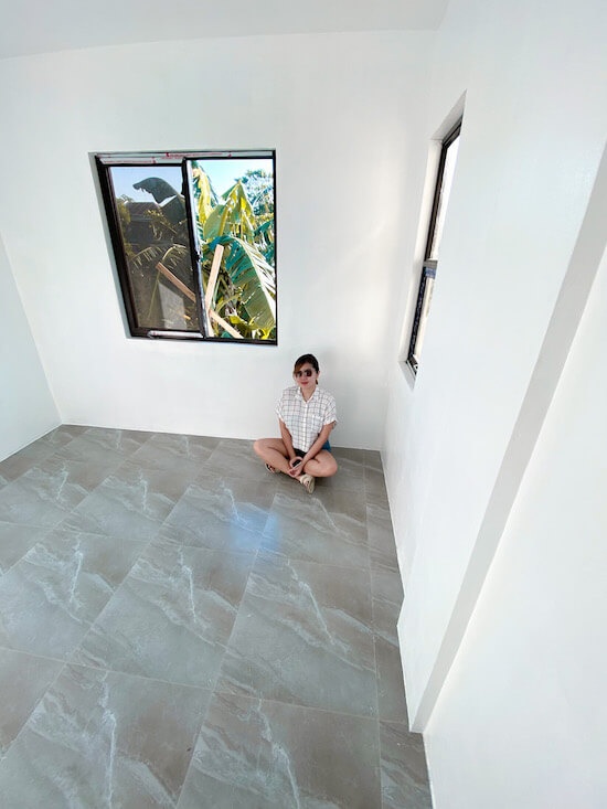 bedroom with installed tiles and white paint