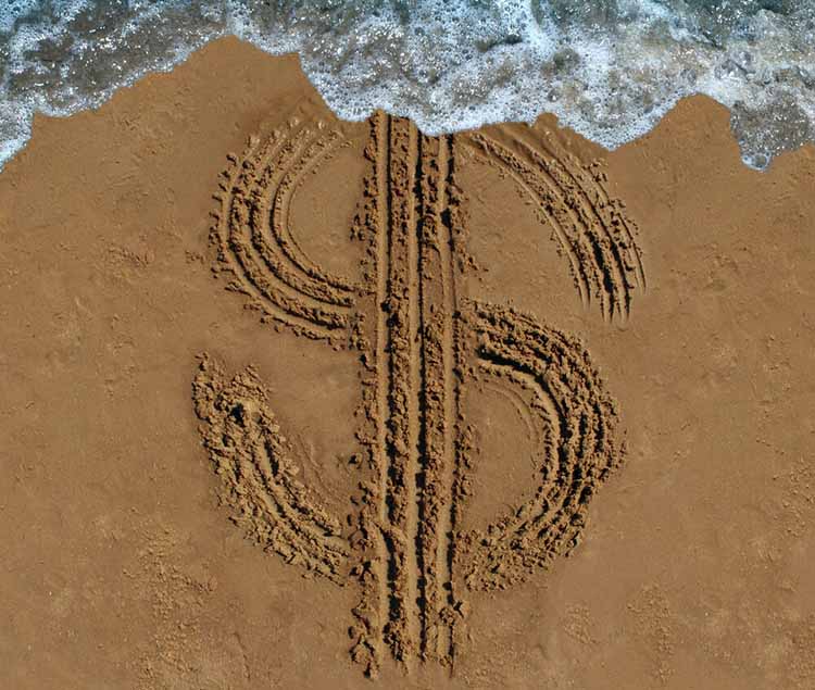 Dollar sign etched into florida beach sand for quick payday loan
