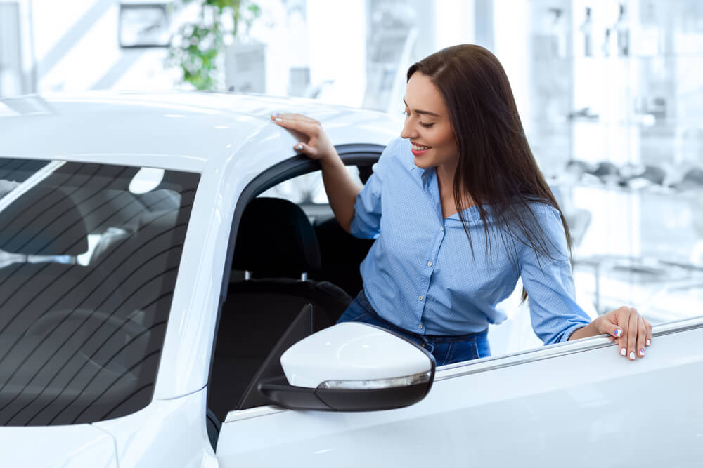 woman learning benefits of being a car owner