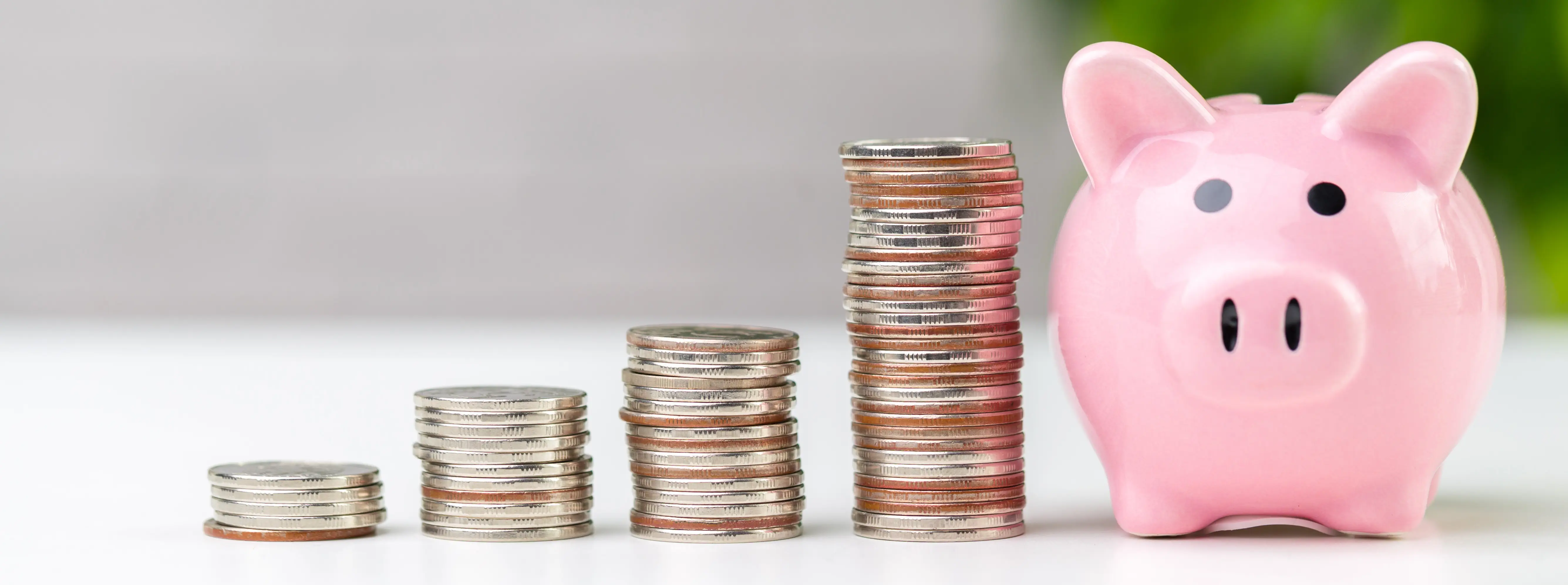 Emergency savings fund concept with piggy bank and stacked coins