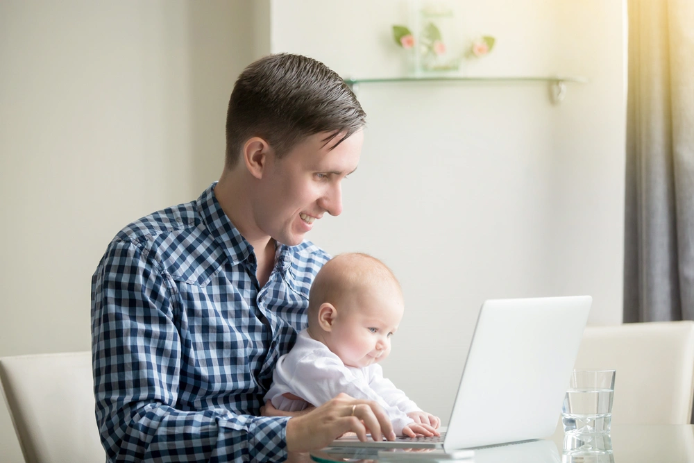 Father and child at computer