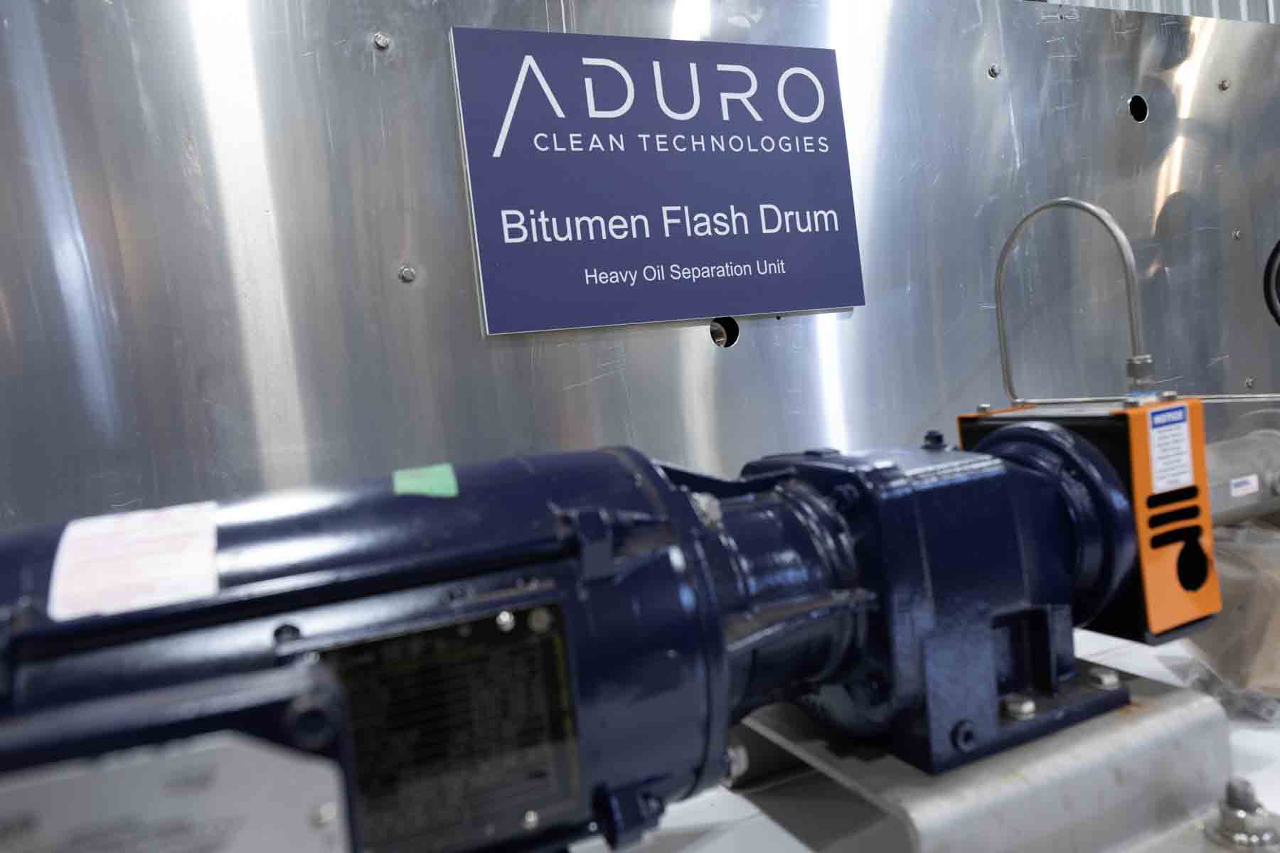 Industrial equipment with a sign indicating bitumen flash drum