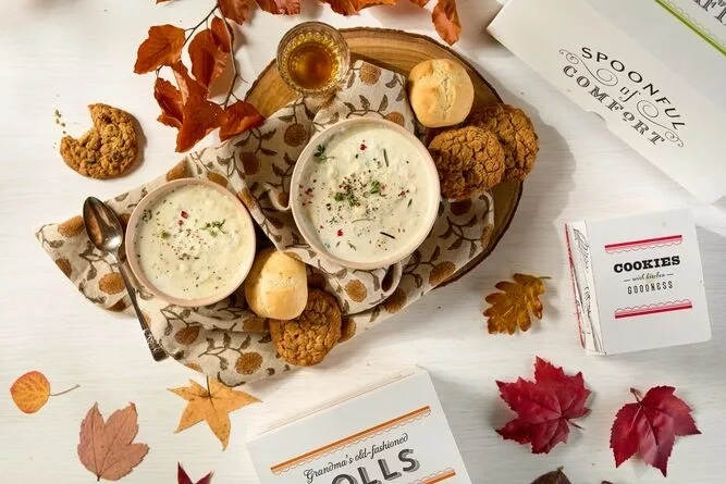 Loaded Baked Potato soup surrounded by fall deorations and cookies.