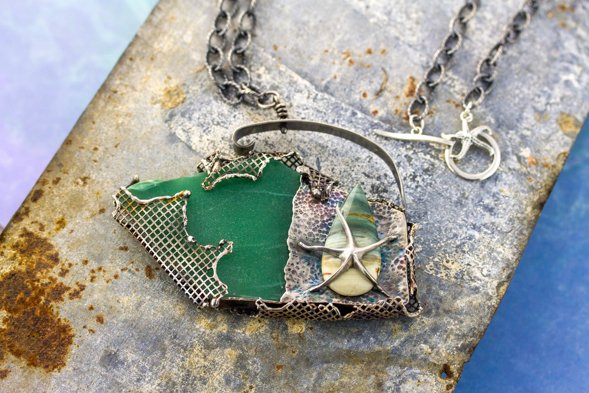 green slab shaped stone set in mesh sheet with a starfish