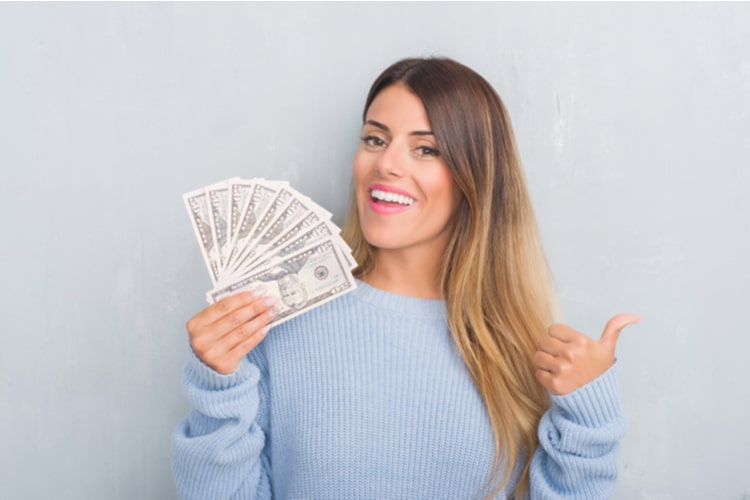 Idaho woman holding title cash