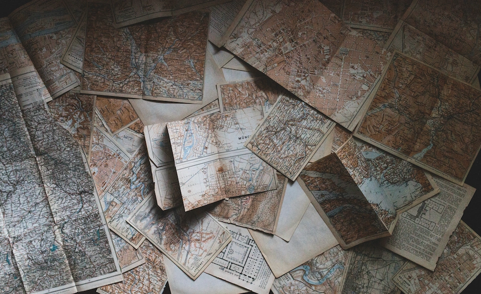 Old maps spread on a desk