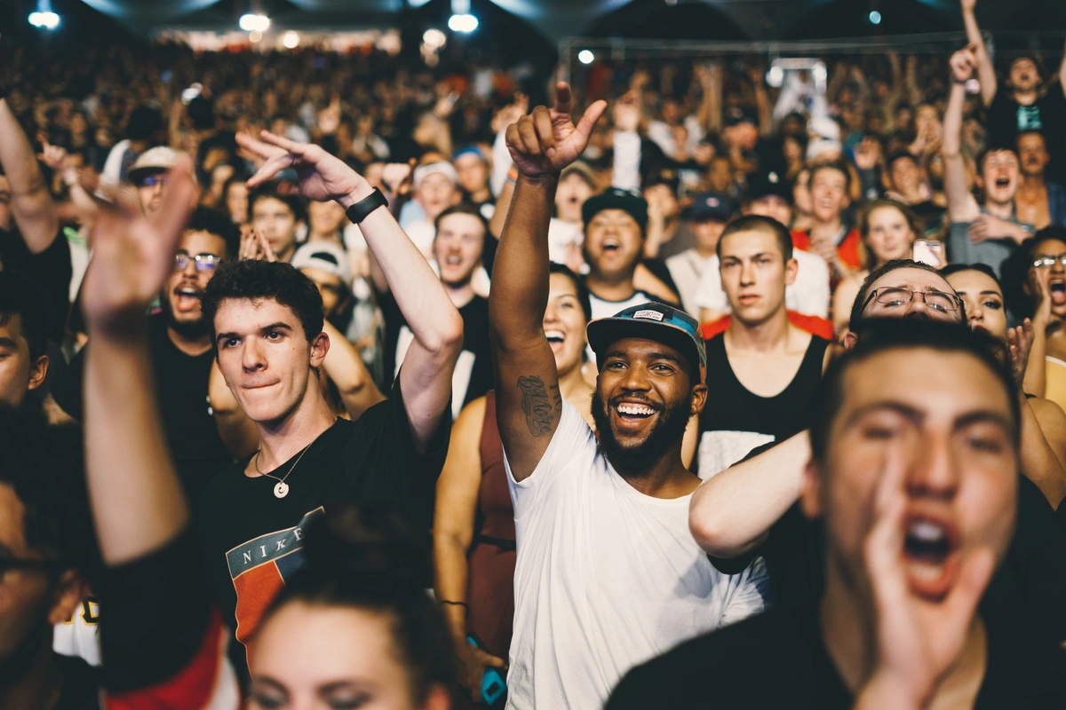 A photo of Gen Zers in a crowd at a live music event. Learn more about the differences between Gen Zers and millennials below.