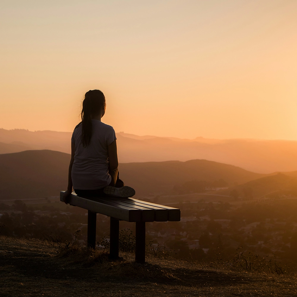 WomanEnjoyingMountainView.webp