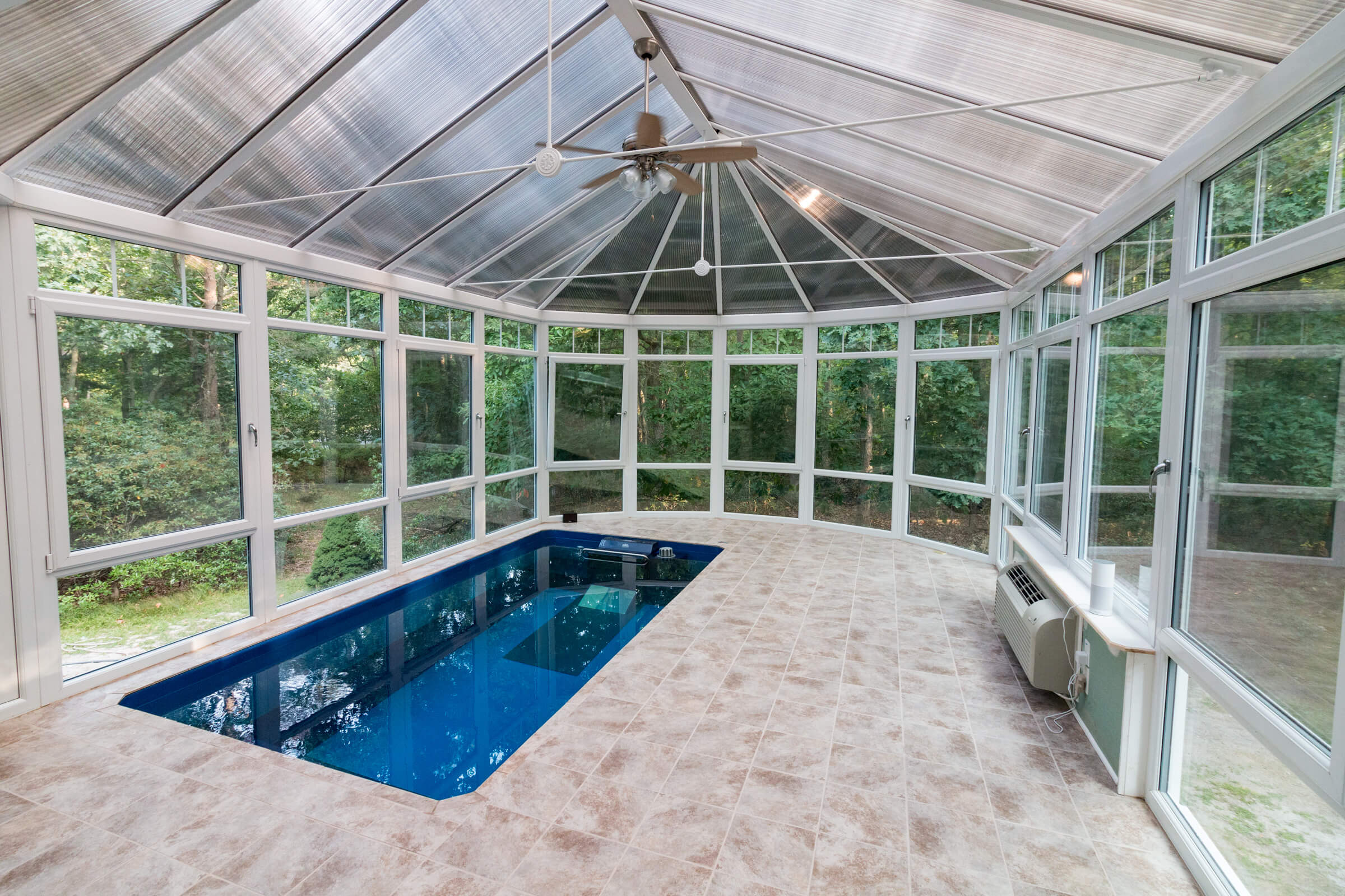 a fully in-ground Endless Pool in a conservatory.