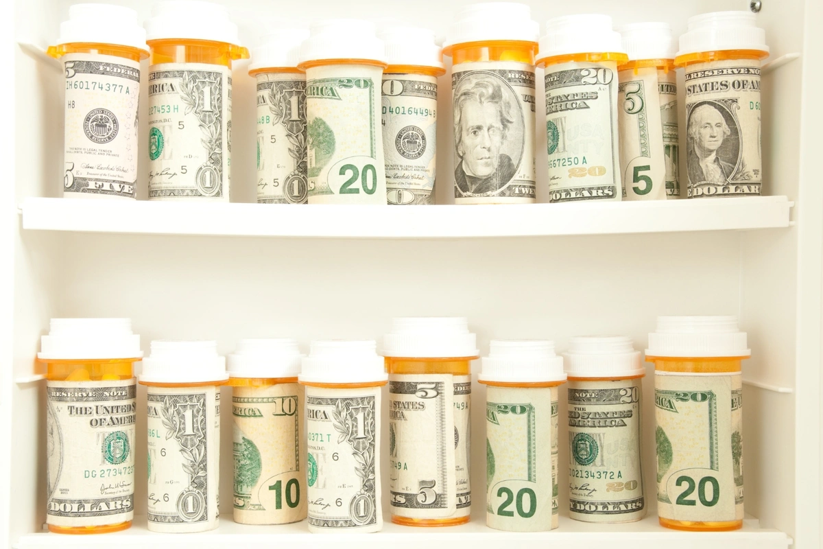 medicine cabinet filled with bottles and cash, all Medicare Part D costs