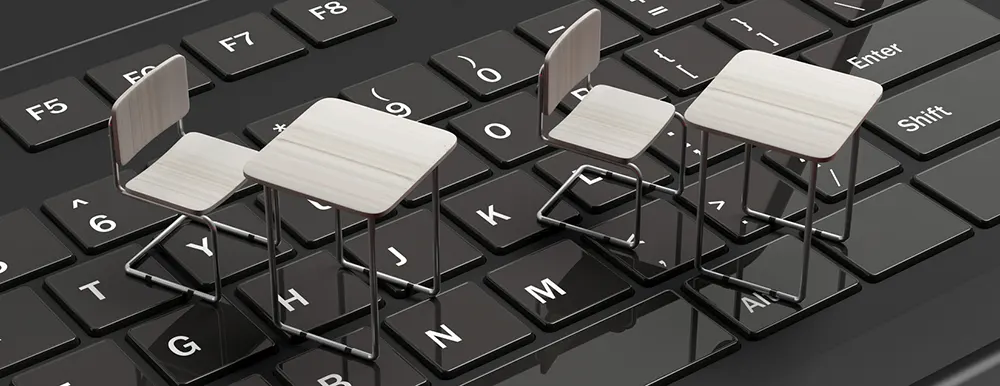 tiny desk chairs on a keyboard