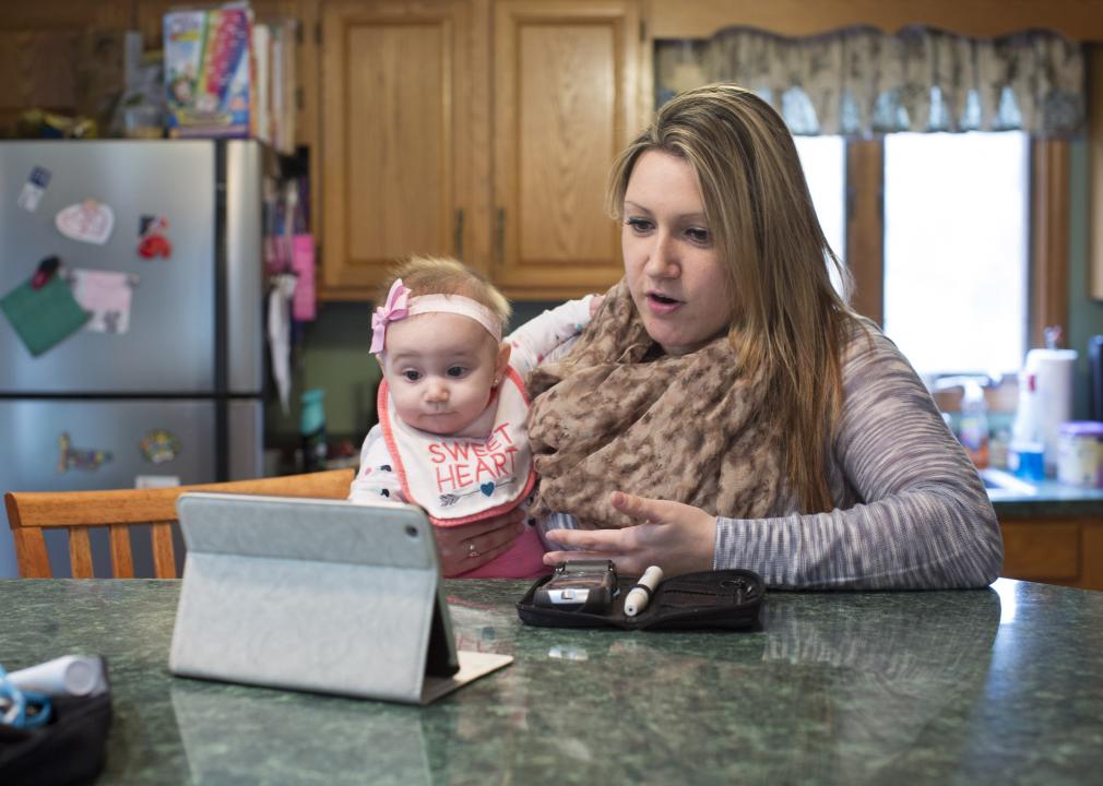 Woman and baby talking to doctor by telemed.jpeg